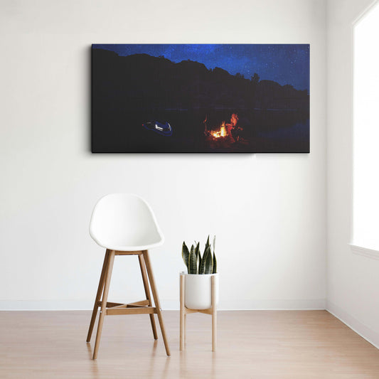 A lake with a fire and mountains canvas wall painting